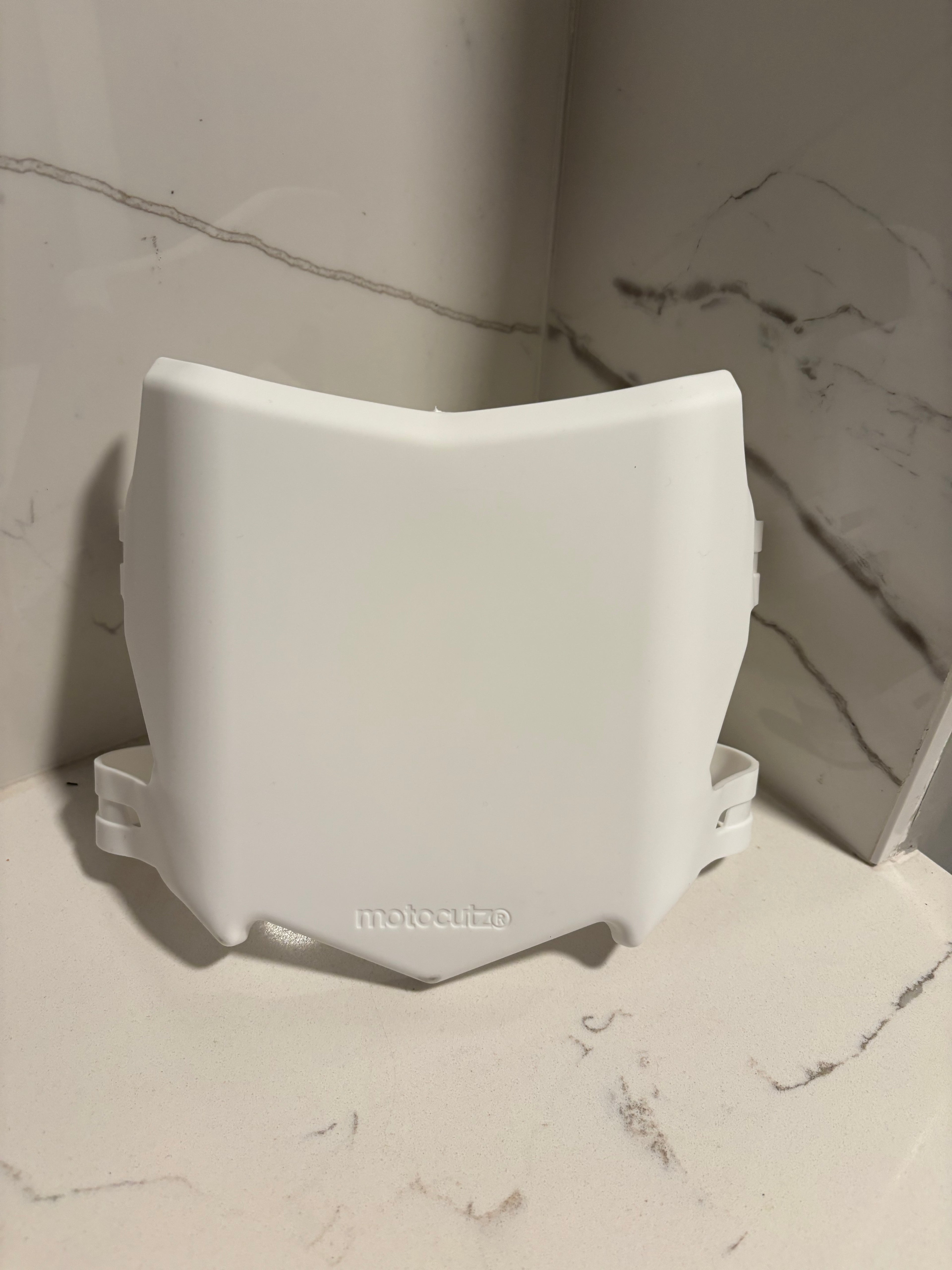 White Motocutz number plate